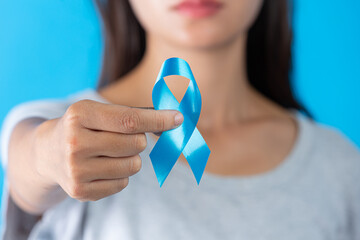 World diabetes day; hand holding blue ribbon