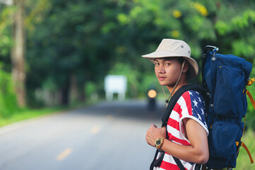 traveler standing on country road