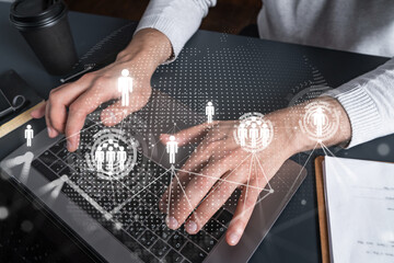 Man using computer. Hands typing laptop. Double exposure with social network hologram. Close up. Media concept.