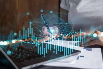 Woman signs agreement. Forex financil market chart and graph hologram. Double exposure . Brokerage concept.