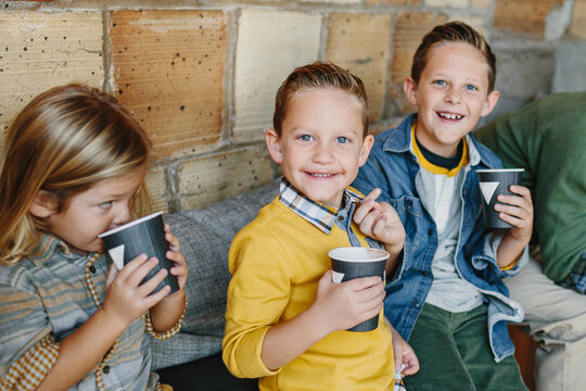 Three kids / boys drinking hot chocolate
