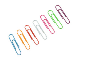 A set of paper clips arranged in a row at an angle to the image orientation