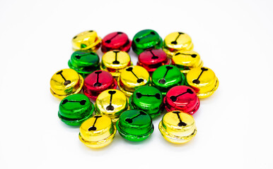 Close up colorful ringing Christmas bells in gold, red and green. The concept of Christmas. Holiday background