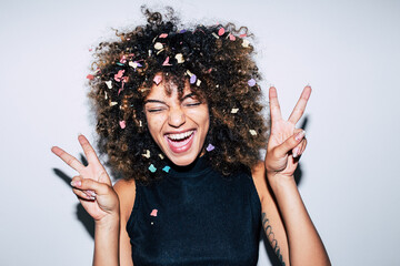 Mixed race woman celebrating a party