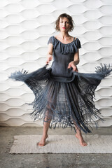 Woman in grey knitted dress
