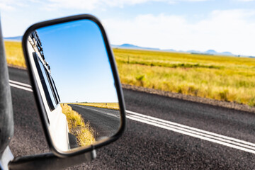 Rear view in a side Mirror of 4x4 vehicle