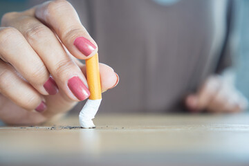closeup woman hand destroying cigarette stop smoking concept  © doucefleur