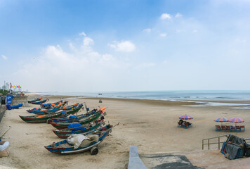Colorful local fishing boats anchored by the coastline at Vung Tau, Vietnam. Selective focus