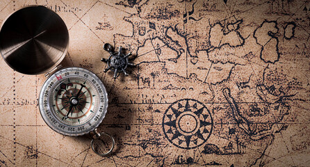 Happy Columbus Day concept. Vintage compass and retro treasure manuscript.  Flat lay, top view with...