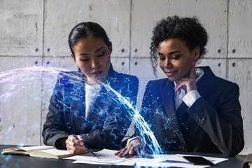 Two businesswomen work together in modern office on new project. Double exposure. Concept of success. Abstract drawing.