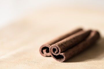 Cinnamon sticks on wooden tabletop
