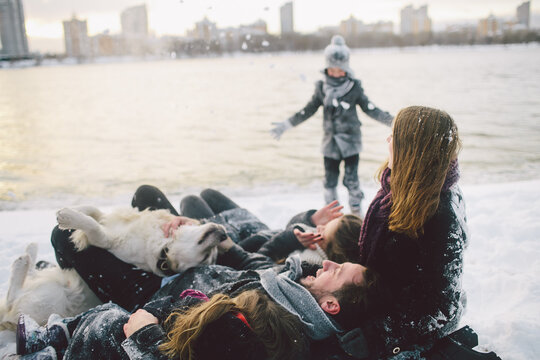 family wallowing in snow