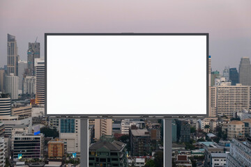 Blank white road billboard with Bangkok cityscape background at sunset. Street advertising poster, mock up, 3D rendering. Front view. The concept of marketing communication to promote or sell idea.