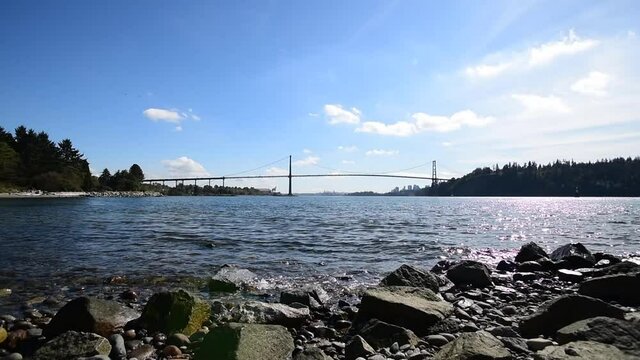 A movie of the Lion's Gate Bridge and the ocean at day time.   Vancouver BC Canada
