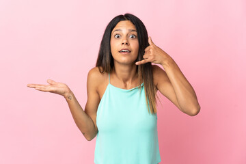 Caucasian girl isolated on pink background making phone gesture and doubting