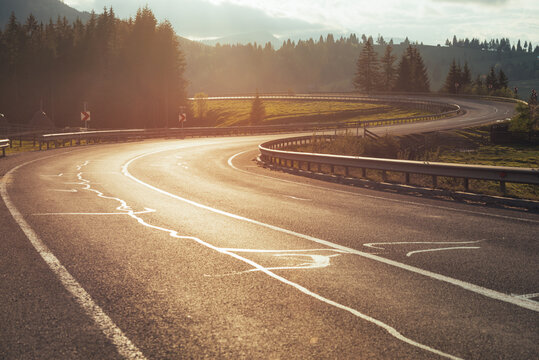 Curved road at sunset