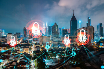 Glowing Padlock hologram, night panoramic city view of Kuala Lumpur, Malaysia, Asia. The concept of cyber security to protect KL companies. Double exposure.