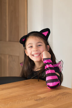 Portrait of a beautiful smiling girl dressed as a cat for Hallow
