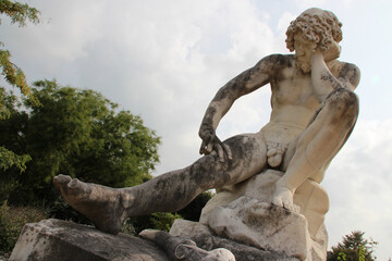 statue of cain in the park of compiegne (france)
