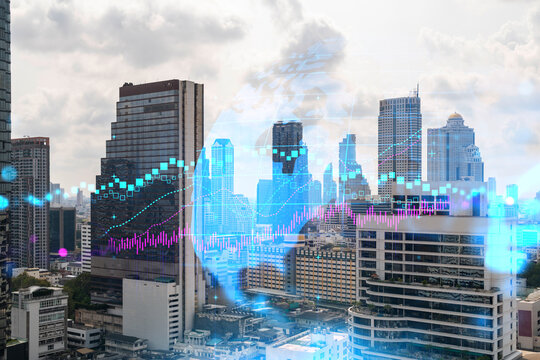 Forex and stock market chart hologram over panorama city view of Bangkok, the financial center in Asia. The concept of international trading. Double exposure.