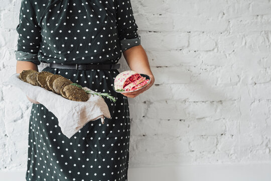 Woman Holding Vegan Butter And Tray With Bread