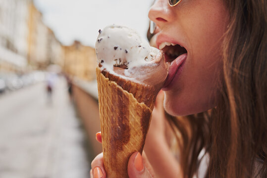 Beautiful girl eating ice cream delicious italian gelato on vaca