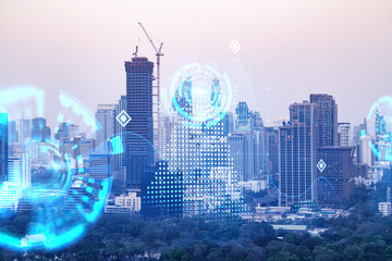 Abstract technology icons hologram over panorama city view of Bangkok, Asia. The concept of people networking and connections. Double exposure.