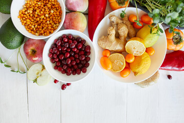 Assortment product of rich in antioxidants and vitamins sources on white wooden background, Trendy Virus protection food, coronavirus, immunity concept. Healthy food nutrition dieting concept..