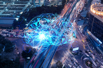Brain hologram on aerial view of road, busy urban traffic highway at night. Junction network of...