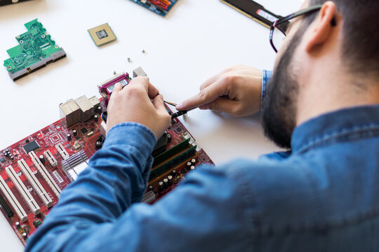 Man repairing motherboard