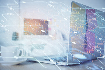 Multi exposure of desktop computer and technology theme hologram. Concept of software development.