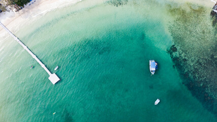 Sea aerial view, The color of the water and beautifully bright. The beach with rocky mountains and clear water of Thailand ocean on a sunny day. Landscape background.