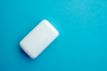 white soap, isolated on blue copy space background. flat lay.Top view.