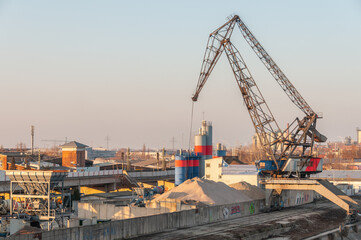 Fototapeta na wymiar Mannheim, Germany. January 30th, 2009. Industrial cement production plant.