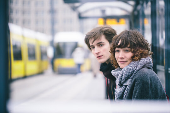 Young couple waiting for a bus