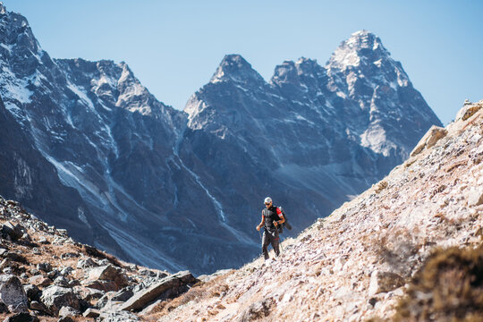 Man hiking on the way to mountain peak