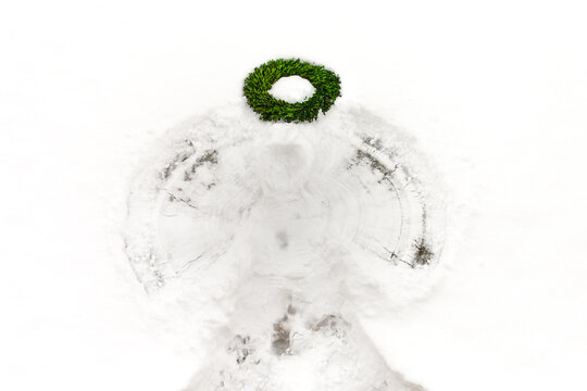 A snow angel with boxwood wreath used as a halo