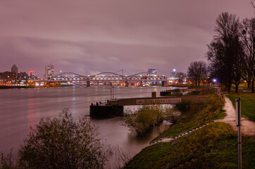 Mannheim, Germany. November 21th, 2013. Night view from the banks of the Rhine river, Ludwigshafen on the left and Mannheim on the right. In the center, the Konrad-Adenauer-Bridge.