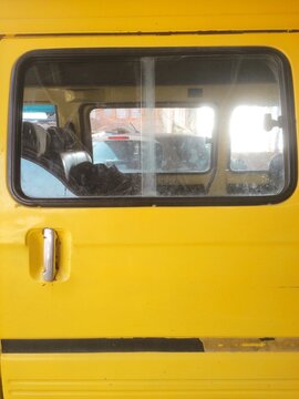 Window in a yellow van.
