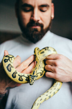 Man holding a python