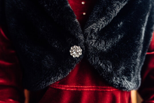 Decorative broche on a fancy dress on a young girl