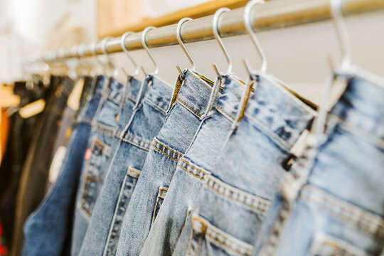 Row of hanging vintage jeans