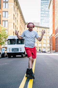Active Senior Lifestyle Image of Man Roller Skating in City Environment