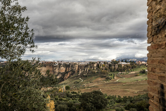 view to andalusian village built on top of a rock, ronda, spain