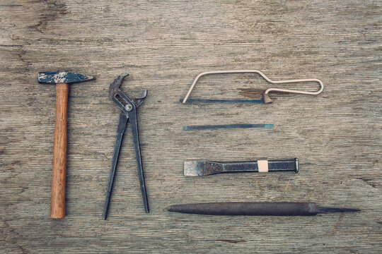 old rusty tools on wooden background