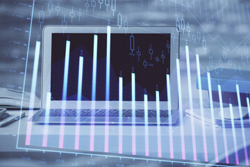 Forex market chart hologram and personal computer background. Double exposure. Concept of investment.