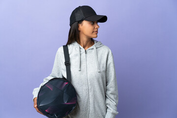 Young sport woman with sport bag looking to the side