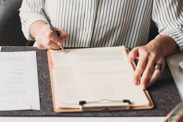 Woman Signing a Document