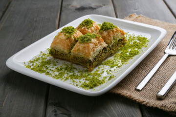 Baklava with pistachio on a white plate horizontal view