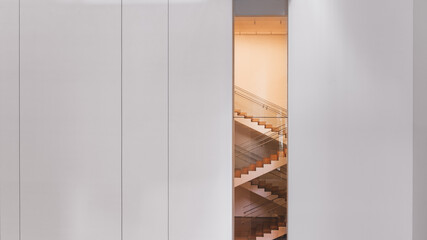 Wooden stairs in a corporate building seen from vertical window